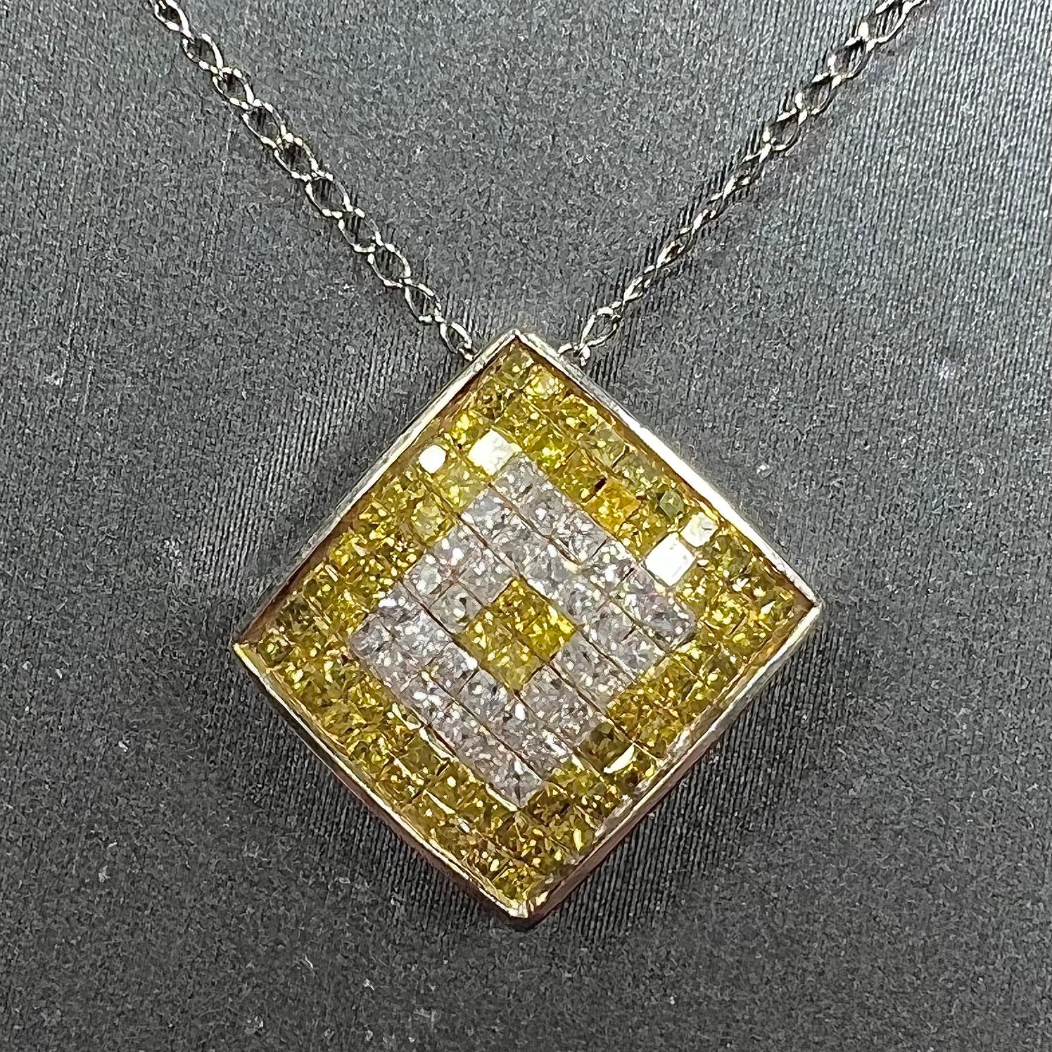 A square shaped necklace set with princess cut yellow and white diamonds in a white gold setting on a white gold chain.