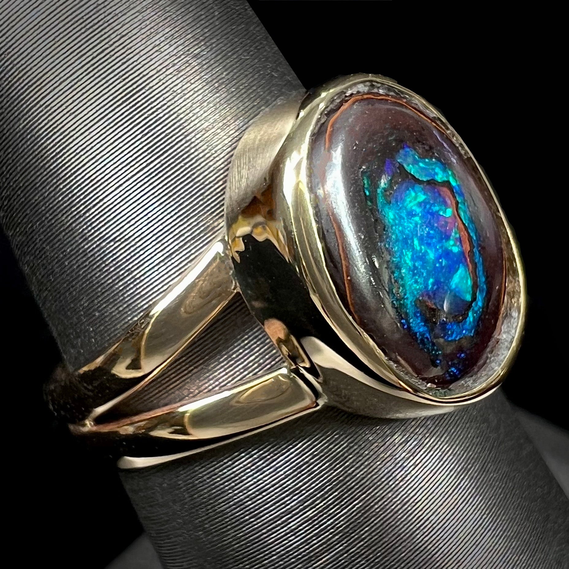 A natural Yowah Nut boulder opal split shank ring in 14kt yellow gold.